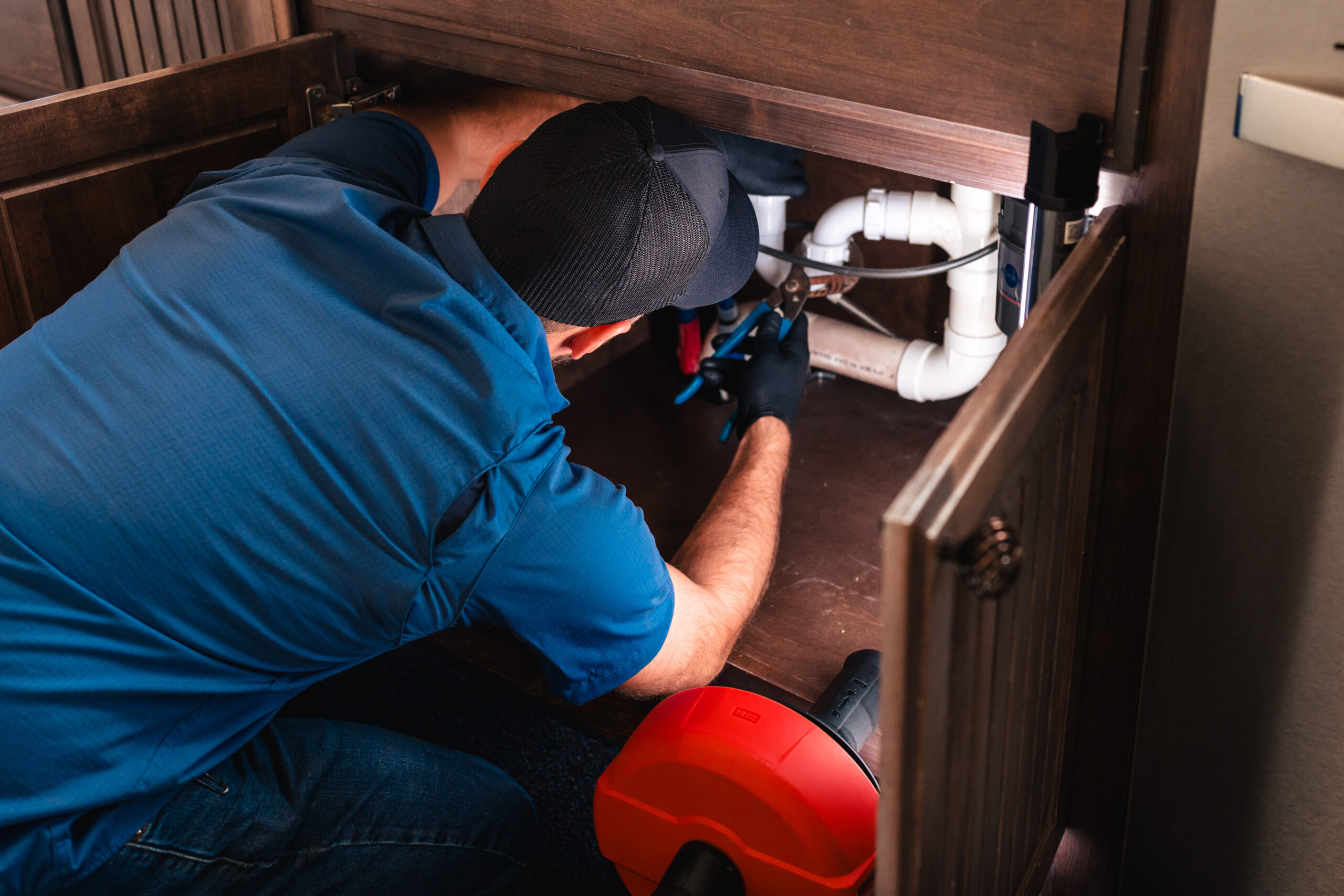 man fixing leakage