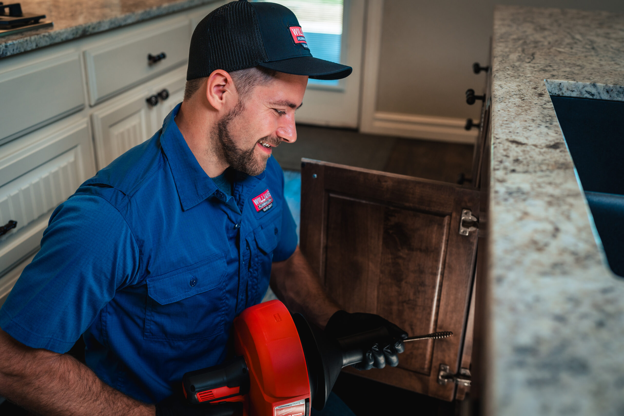 man fixing faucet